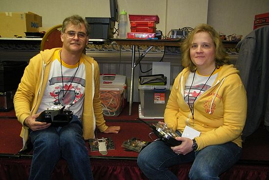 Cloak & dagger Robotics\nChris & Tiffany Olin with ant weight robots "Viper Fighter" and Zombie Chapper"